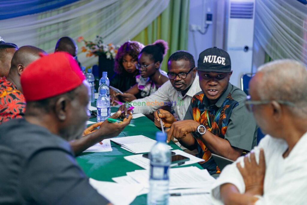 Local government officials, civil society actors, and community leaders debating what decentralised power should mean in practice for citizens.